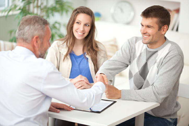 A couple meeting with a bank manager.