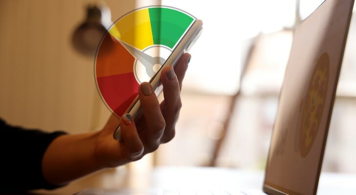 A consumer checks their credit report on their phone.