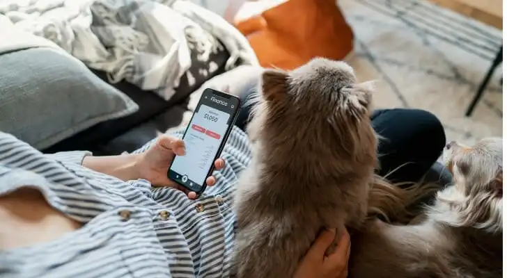 A man checking his investment account on his phone.