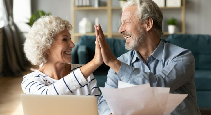 A senior couple reviewing their retirement plan.