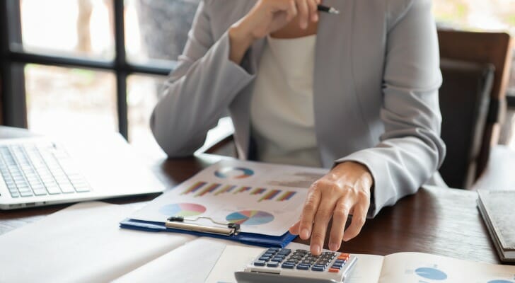 Woman rebalancing her portfolio