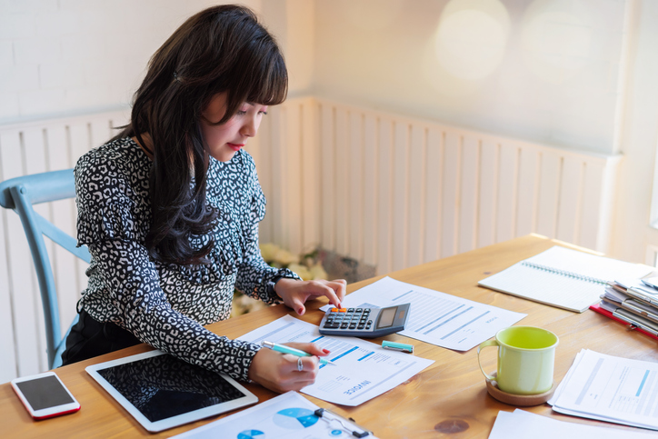 A woman reviewing a financial plan from her advisor.