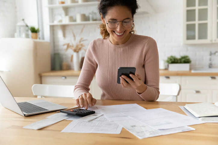 A woman reviewing her bank statements.