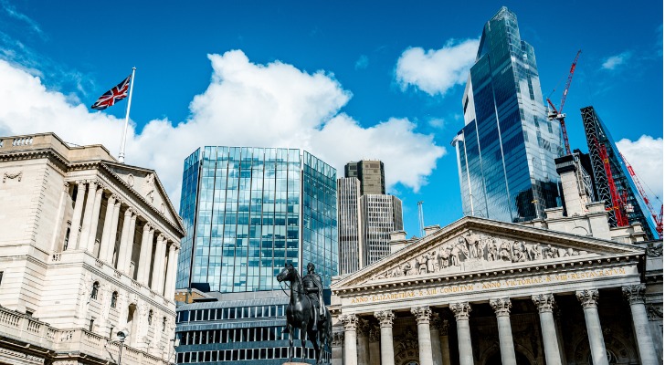 Federal Reserve buildings in front of a city skyline.