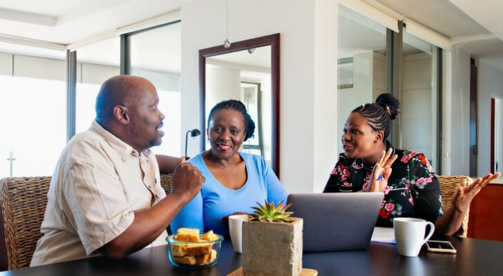 A husband and wife discuss their estate plan. An AB trust can help couples minimize the estate taxes owed on the transfer of assets after the death of the second spouse.