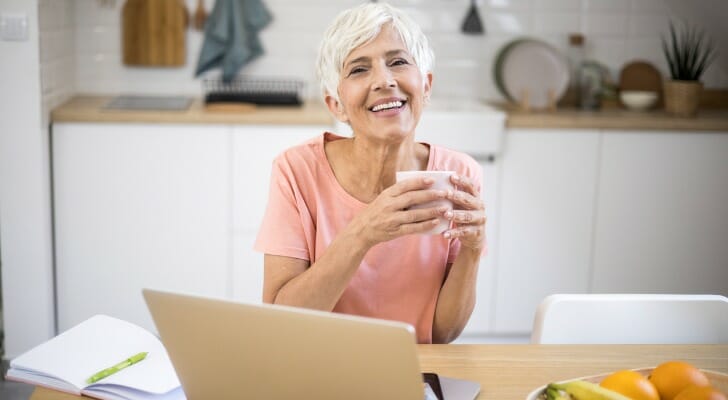 A woman researches "Can I retire at 60 with 500k?"