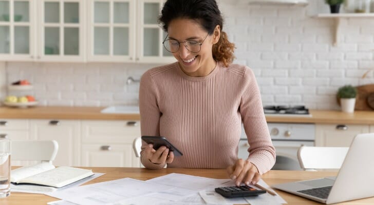 A woman uses a mobile app to do digital banking.