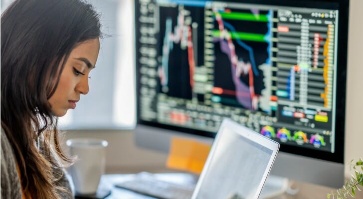 A woman works on investing $10 million in a portfolio.