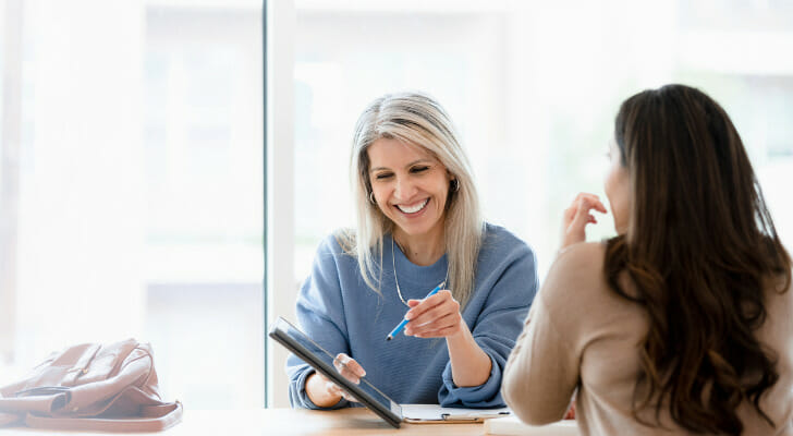 A woman interviews with a financial advisory firm.