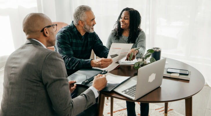A financial advisor sits down with new clients.