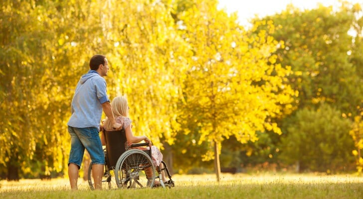 Handicapped woman in a wheelchair outside