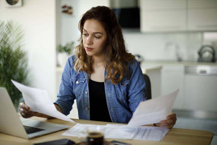 A woman reviewing her bank statement.