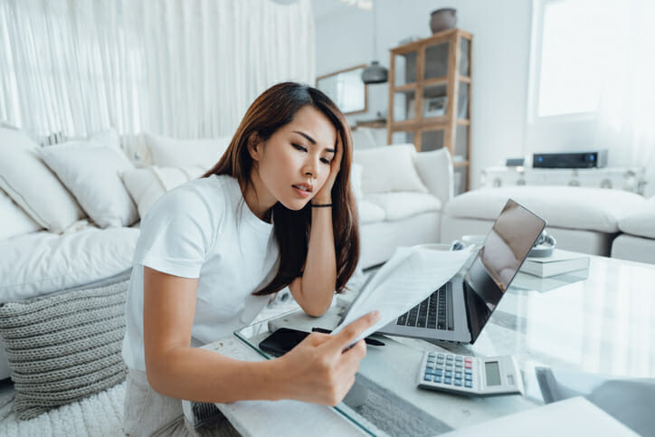 A woman reviewing her bank account deposits.
