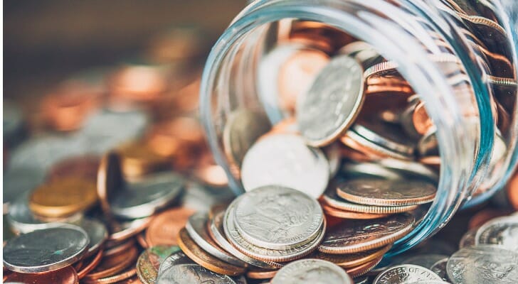 money-jar-filled-with-american-currency-savings-and-donations-concept - SmartAsset