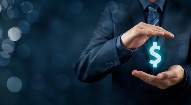 Man holding a dollar sign