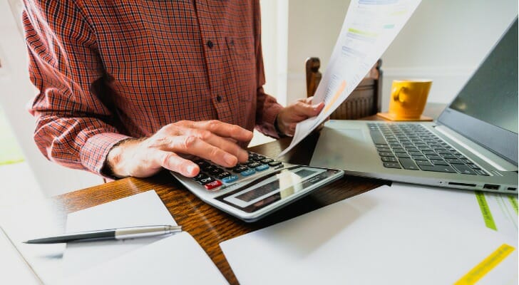 A retiree calculates what they owe in taxes.