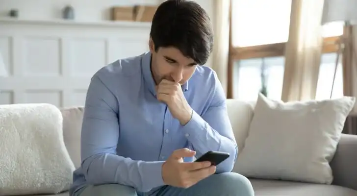 A man researching how to invest and make money daily.