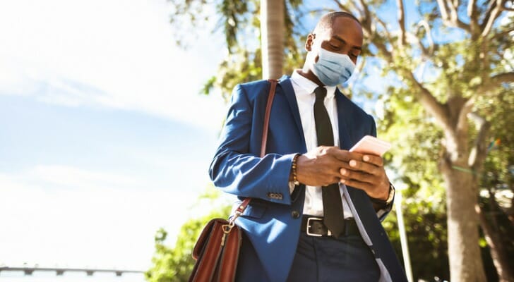 An investor using their mobile phone to check their investment account.