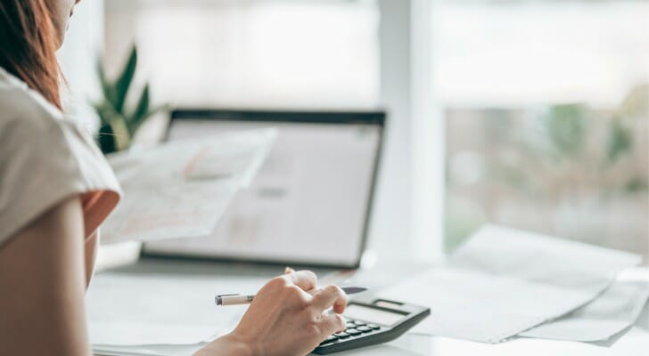 A woman reviews a statement from her money market account.