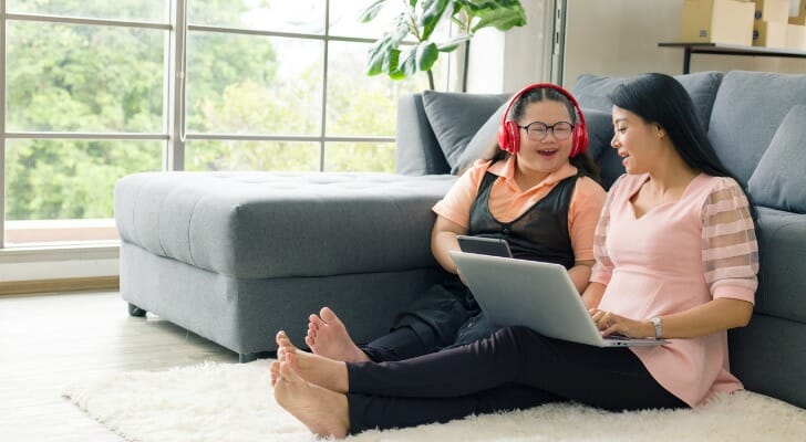 A parent and child discussing if a grown child can collect parents' Social Security.