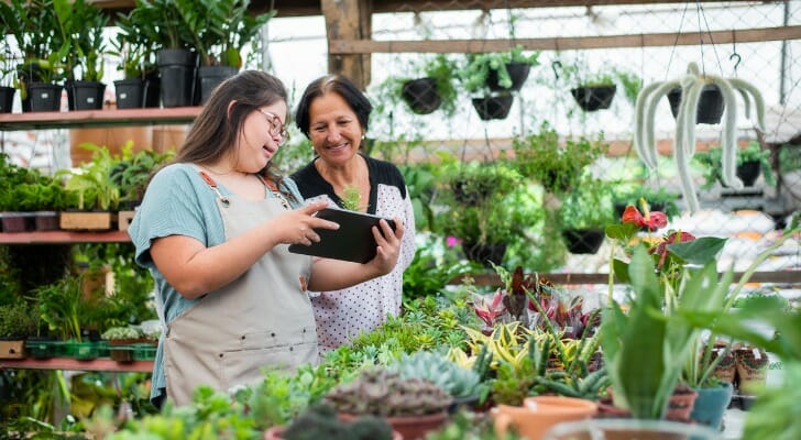A parent and child at a gardening center.