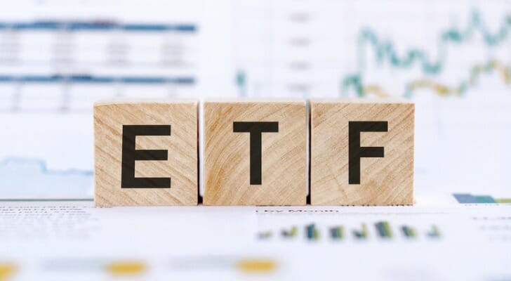 Wooden blocks spelling out "ETF."