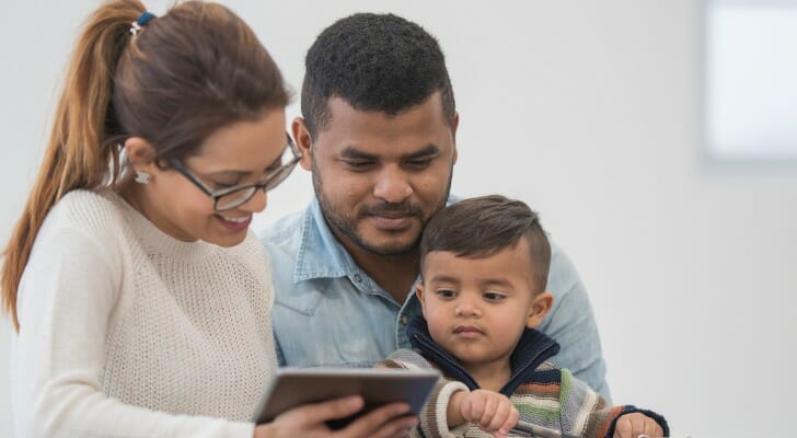 A family reviewing a college fund for their son.