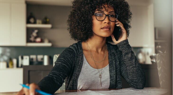 A woman calling her financial advisor.