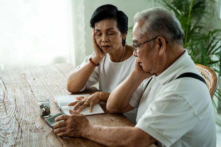 A senior couple discussing Medicare options.