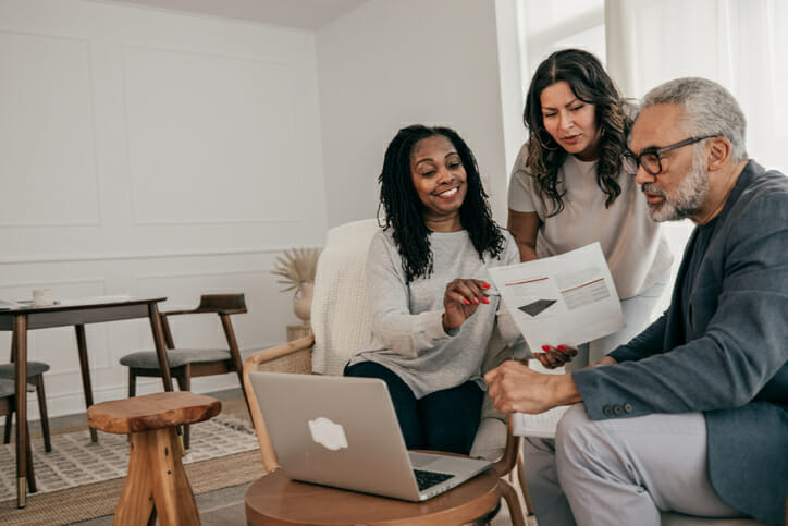 A couple discussing with their advisor if $2 million is enough to retire at 65.