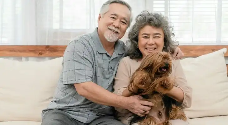 A couple enjoy their retirement, having decided between an IRA rollover vs IRA conversion.