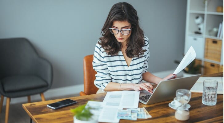 A woman filing her taxes.