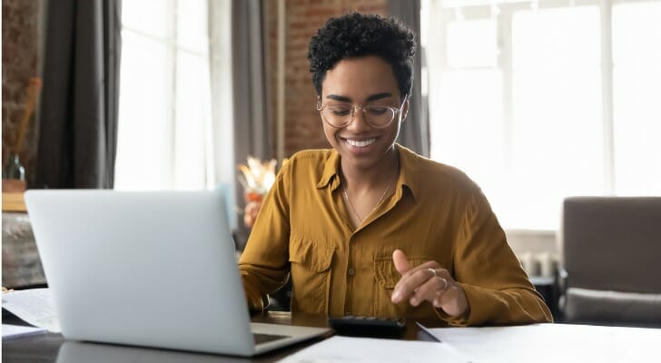 A woman filing her taxes online.