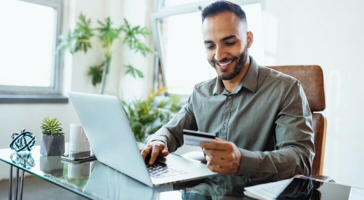 A man activates his new debit card.