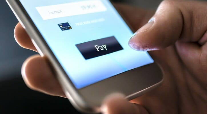 A consumer using a mobile app to make a payment.