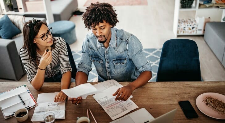 A couple determine how much to invest per month.