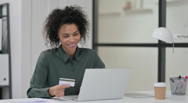 A woman researching "are online banks safe."