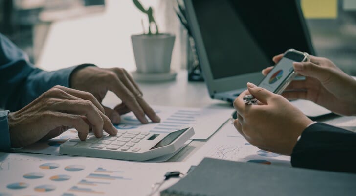 An investor discusses with their advisor how much to invest per month.