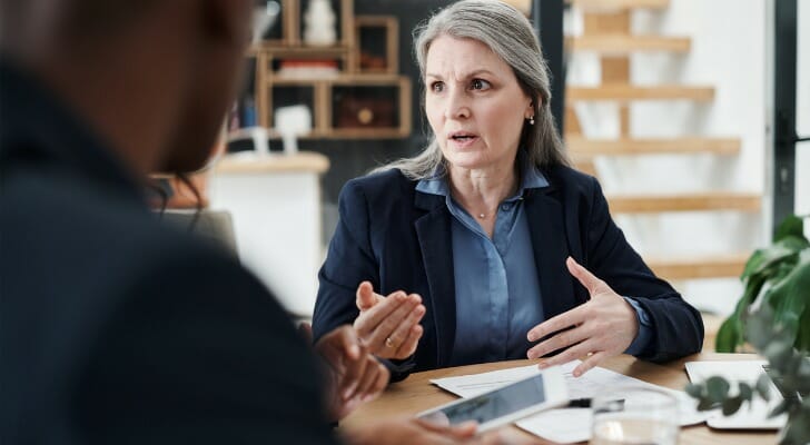 Two advisors discussing how their firm could nurture leads and grow AUM.