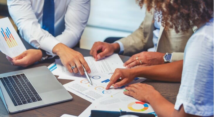 Advisors reviewing their first-year financial advisor goals.