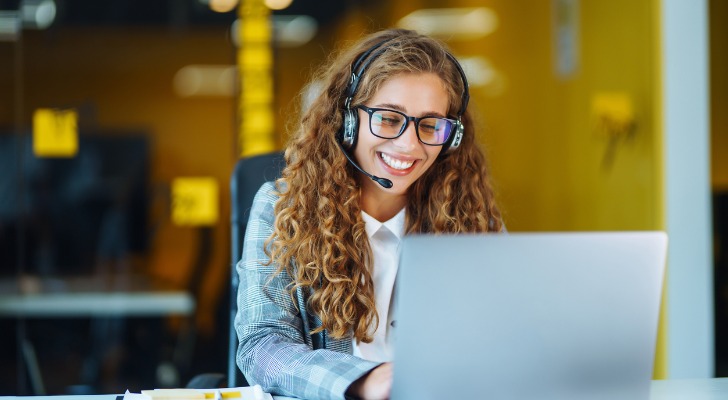 A financial advisor working with a client over the phone.
