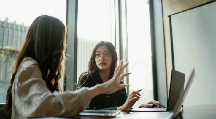 Advisors discussing a prospecting strategy.