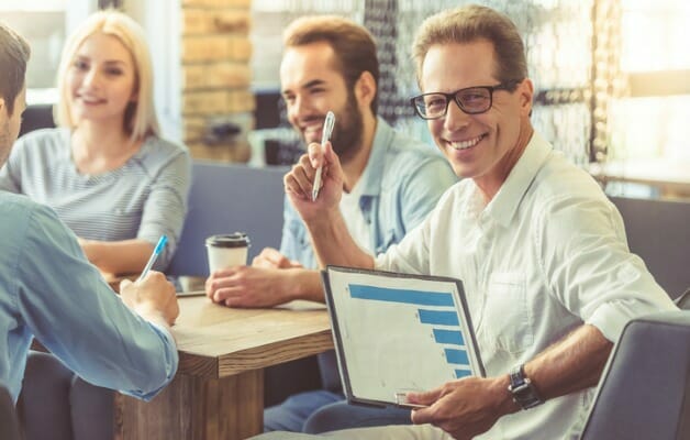 A group of financial advisors having coffee.
