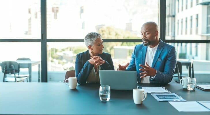 An employee and their financial advisor discuss how Roth 401(k) matching works with your employer.