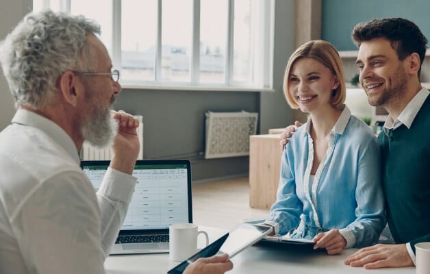 A couple meeting with their financial advisor.