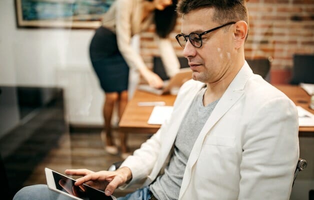 A man researching if he can be a part-time financial advisor.