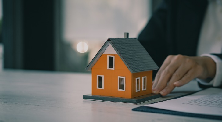 A model of a house sitting on a desktop