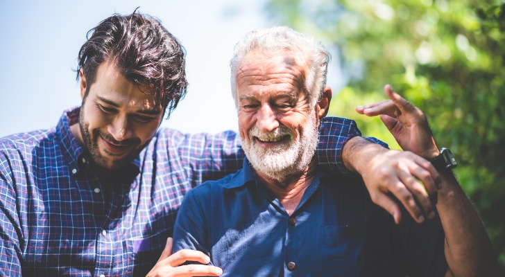 Son and father taking a walk to discuss asset control.