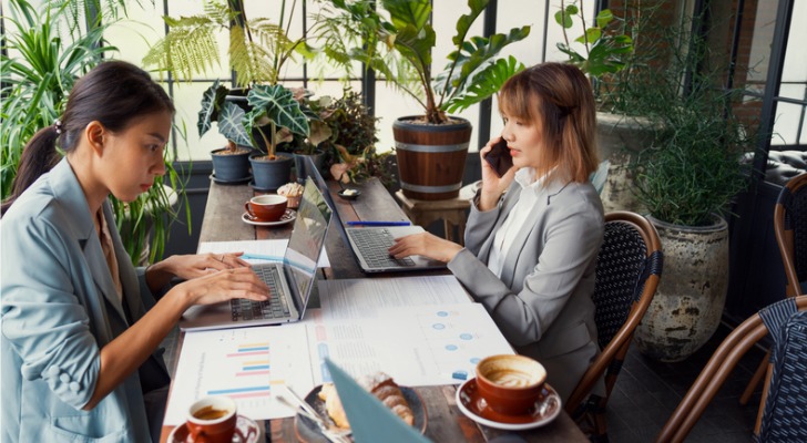 Two financial advisors creating social media content