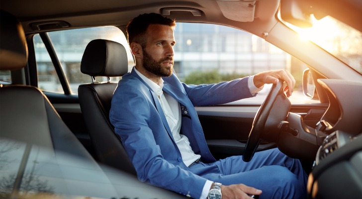 A man drives home in a company car. Personal use of a employer's car is considered imputed income.